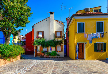 Street with colorful buildings in Burano island, Venice, Italy. Architecture and landmarks of Venice, Venice postcard