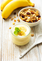 Banana yogurt, granola and fresh bananas