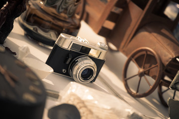 Vintage camera, tiny car and more on a flea market
