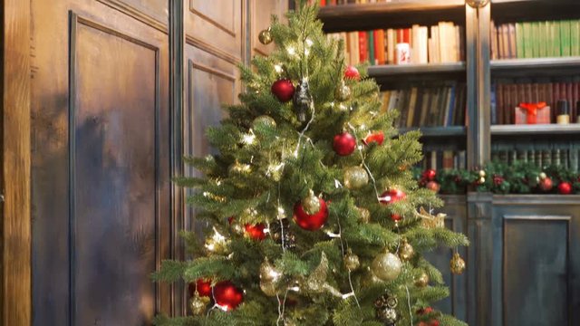 Merry Christmas beautiful video, Xmas tree with garland, pleasant atmosphere. Best use for Xmas gifts and titles with a greeting inscription