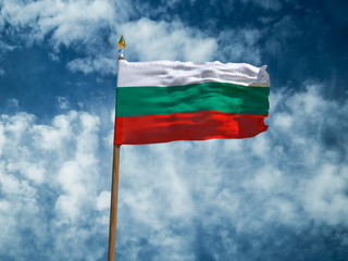Bulgaria flag Silk waving flag of Bulgaria made transparent fabric with wooden flagpole gold spear on background sunny blue sky white smoke clouds real retro photo Countries of world 3d illustration