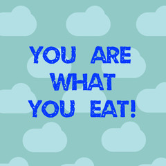 Word writing text You Are What You Eat. Business concept for Have a healthy lifestyle take care of your foods Blue Sky Clouds Floating Repeat Blank Space for Poster Presentation Cards
