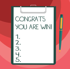 Text sign showing Congrats You Are Win. Conceptual photo Congratulations for your accomplish competition winner Blank Sheet of Bond Paper on Clipboard with Click Ballpoint Pen Text Space