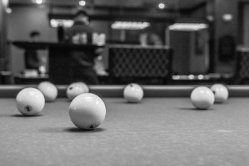 The game of American and Russian billiards. Pool table, ball and cue. Sports leisure. Friendly tournament. Winter fun. Green cloth in billiards. Luza for the ball. Aim and beat. Cue kick. - obrazy, fototapety, plakaty