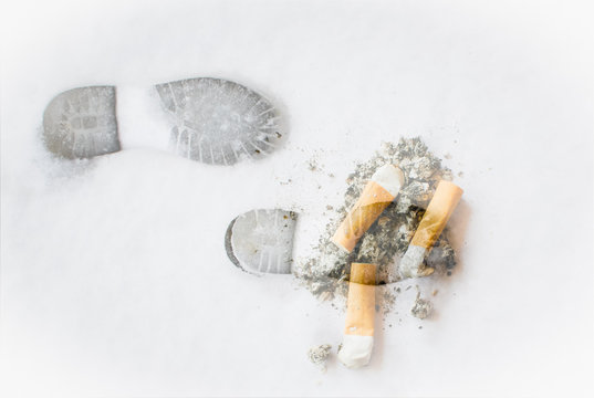 Double exposure with foot prints in snow and ashes and cigarettes, extinguish the cigarette, concept for stop smoking and idea of healthy life 
