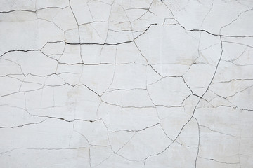 Old cracked paint on the concrete wall