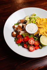 Delicious diet salad with avocado on the bar