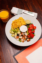 Dietary salad bowl with juice in a restaurant