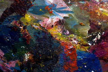 Fototapeta na wymiar multi-colored strokes of oil paint on the artist's palette. background