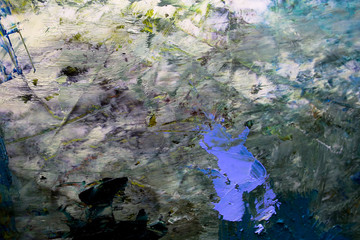 multi-colored strokes of oil paint on the artist's palette. background