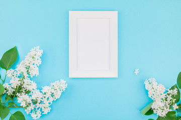 Blank frame mockup with white flowers