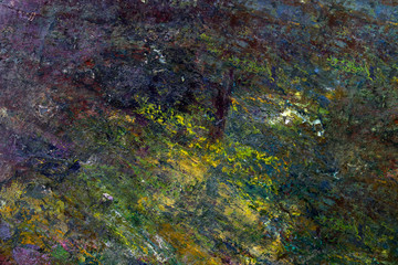 multi-colored strokes of oil paint on the artist's palette. background