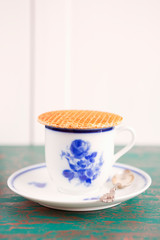 Obraz na płótnie Canvas Cup of coffee with a Dutch stroopwafel cookie