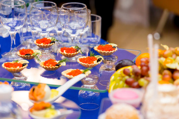 Red caviar on the table. Delicacies and Cutlery at the buffet. Catering.