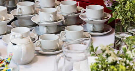 Utensils for tea and coffee on the table.