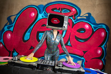 tv head woman and graffiti wall dj