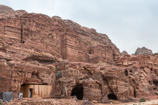The man-made facade of the temple carved in red mountain in Petra - the capital of the Nabatean kingdom in Wadi Musa city in Jordan
