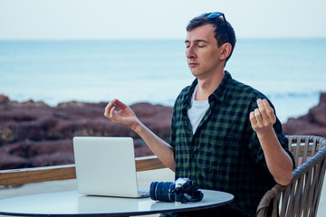 remote work surfing and freelance vacation. Young freelancer surfer businessman working laptop...