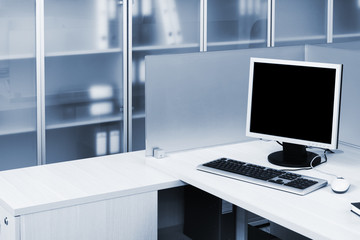 Plakat computer on a desk in modern office