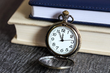 Vintage pocket watch with books