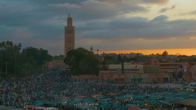 Jemaa el Fna square and the Koutoubia Mosque in Marrakech at sunset time