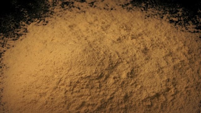 Spice Powder Is Poured Into Pile