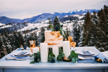 Exquisite wedding decor in the winter style in the mountains