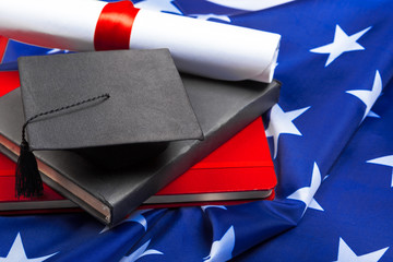 graduation hat on US flag, education concept