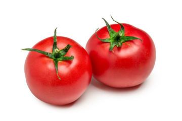 Tomatoes isolated on white background. Two fresh raw vegetables