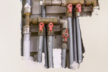 Water pipes from metal in the wall, plumbing in the house. Installation of sewer pipes in the...