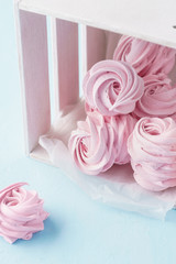 Homemade pink marshmallow or zephyr in a box. Pastel colors.