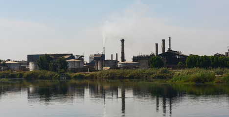 Landscape view of large factory on river nile in Egypt