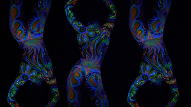 Psychedelic effect, young woman with colorful body art, shaking her butt