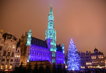 Fototapeta na wymiar Christmas lights show on the Grand Place with a huge Christmas tree in BRUSSELS, BELGIUM. 16-12-2018