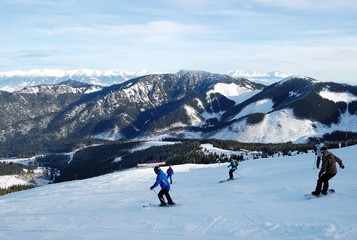 View of the ski slopes and snow-covered mountain ranges of the Tatras in the resort of Jasna.