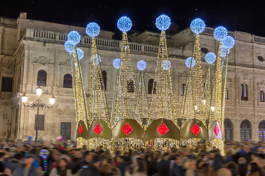 Long exposure photography of Christmas decoration lights in city hall of Seville
