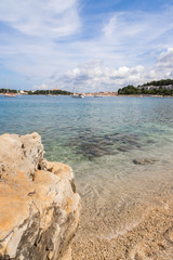 Fototapeta na wymiar Gravel beach with rocks on the croatian Coast, clear water