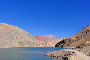 Fototapeta na wymiar Laguna Agua Negra lagoon with andean mountains at the road to the Paso Agua De Negra, Elqui valley, Vicuna, Chile