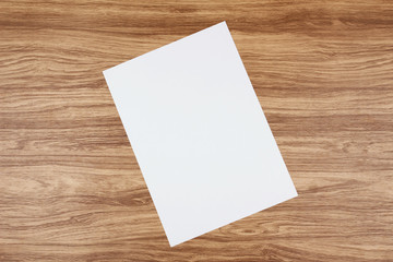White paper and space for text on wooden background