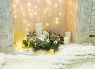 Decorated fireplace with garland.
