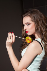 beautiful woman eats sweet candy lollipop sweets tasty