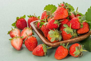 A beautiful and delicious strawberries set isolated on colorful background, close up, macro, copy space.