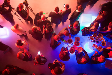 Party and corporate concept. People at the tables, top view. - obrazy, fototapety, plakaty