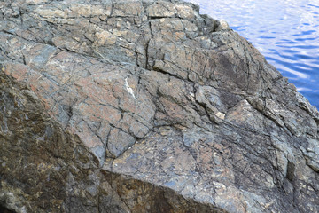 stones in the sea, rocks, structure of stone, veins