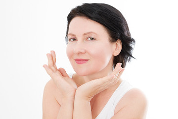 Obraz na płótnie Canvas Beauty middle age woman face portrait. Spa and anti aging concept Isolated on white background. Plastic surgery and collagen face injections. Wrinkles and menopause. Mock up. Copy space