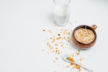different types of groats in pots on a white background