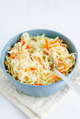 Bowl with sauerkraut and fork
