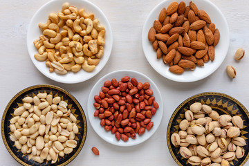 Fototapeta premium Assorted fresh nuts in bowls