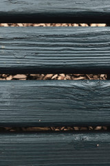 Horizontal Wooden planks painted green teal on natural brown background