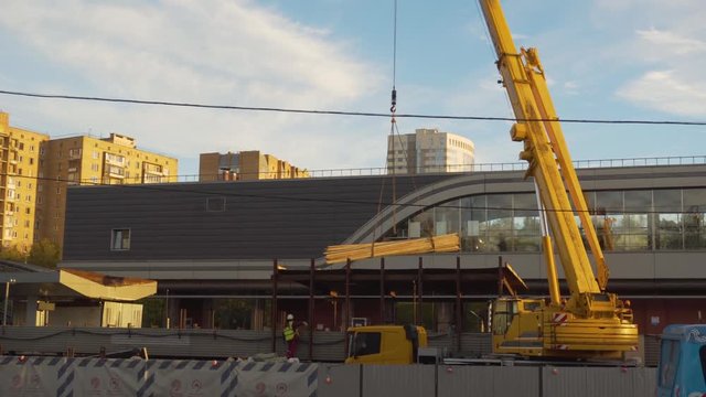 Moscow metro construction site. Cranes working and trains going through. Renovation